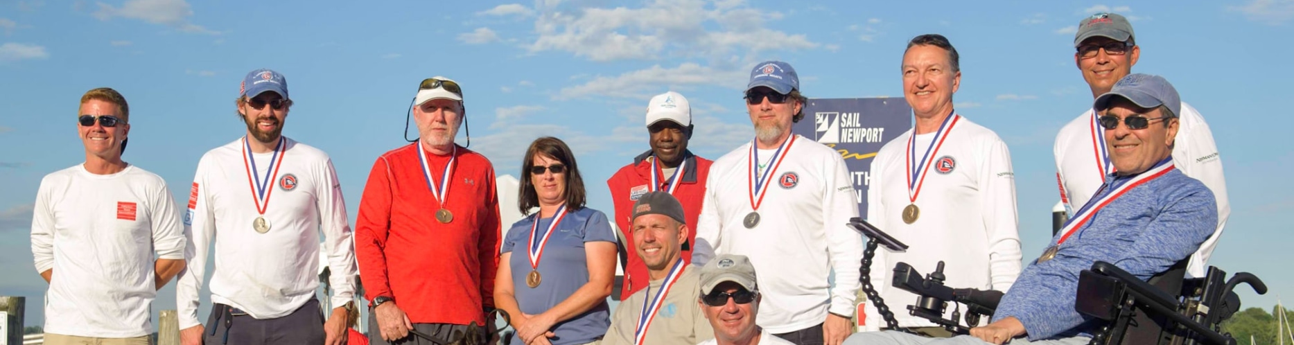 A group of Clagett Sailors at the Clagett Regatta, sailors are wearing medals and smiling