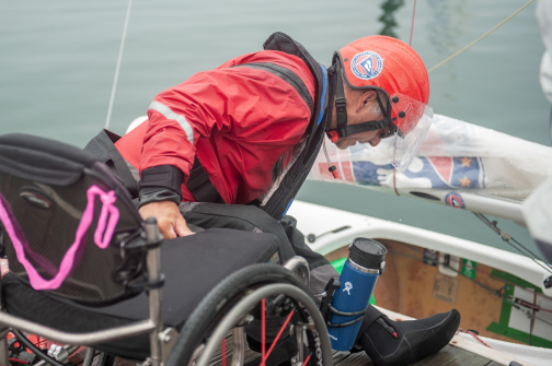 Two Clagett sailors working together on the dock